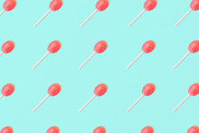 Trendy Mint Pattern Made Of Pink Lollipop. Pink Background. Minimal Concept. Sweets.