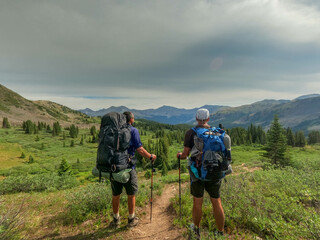 Thur-hikers looking at the distant view of the  Collegiate Peaks on the 485 mile Colorado Trail, Colorado