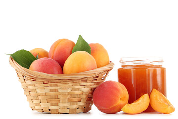 Wall Mural - Fresh apricots in basket and jam in jar isolated on white background