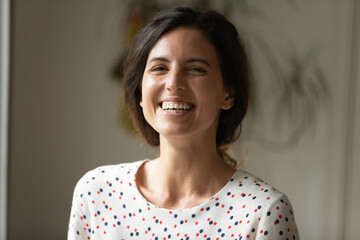 Poster - Portrait of happy joyful woman looking and laughing at camera, webcam while making video call from home. Student, employee, job candidate having fun during remote talk, meeting, interview. Head shot