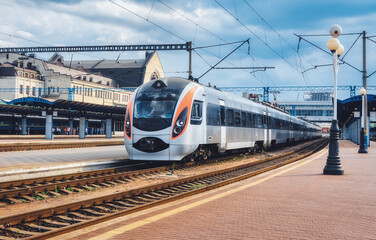 Wall Mural - high speed train at the railway station in ukraine