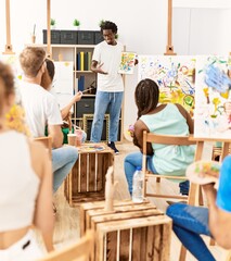 Canvas Print - Group of people smiling happy drawing in paint class at art studio.