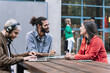 © EFStock - Young journalist content creator recording informal conversation interview with trendy woman. Modern millennial people making podcast for online social media radio networks. Focus on bearded man