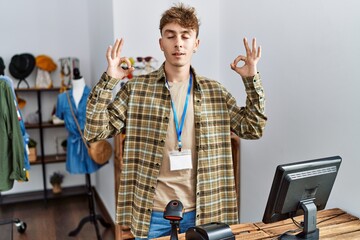 Sticker - Young caucasian man working as manager at retail boutique relax and smiling with eyes closed doing meditation gesture with fingers. yoga concept.