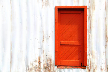 Wall Mural - bright orange vintage retro barn farm building door doorway entrance paint rust architectural background