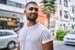 © Krakenimages.com - Young middle east man smiling happy standing at the city.