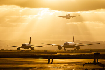 airplane taking off at sunset, airport traffic, airfraft taxing