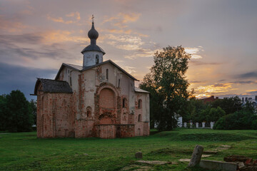 View of the Church of St. Paraskevi (Paraskevy Pyatnitsy na Torgu) on the territory of Yaroslavovo Dvorishche against the background of the dawn sky, Veliky Novgorod, Russia