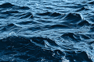 abstract background, texture sea blue water, waves and ripples on the ocean, sea pattern wallpaper