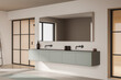 © ImageFlow - Light bathroom interior with sink and mirror, shower behind glass doors