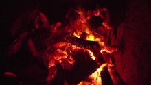 Dry Woods Smolder In Bright Camp Bonfire With Hot Orange Flame On Manless Wild Beach At Dark Late Night In Vietnam Extreme Closeup