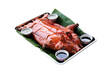 Chinese style barbecued suckling pig serve on tray isolated on white