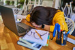 © Тарас Нагирняк - Exhausted woman lay down on a table in the office at work