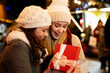 Portrait of happy women exchanging christmas presents. Holiday people christmas happiness concept