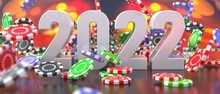 2022 New Year Celebration And Poker Chips Falling On Casino Table. 3d Illustration