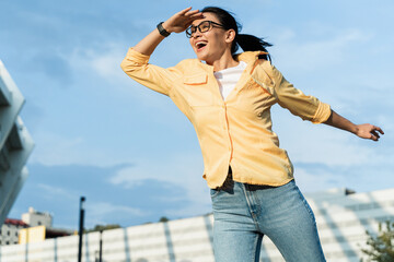 Portrait of woman squinting eyes and peering into distance, looking far away with attentive view, searching on horizon and curious to discover. Stock photo