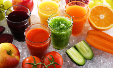 Glasses with fresh organic vegetable and fruit juices