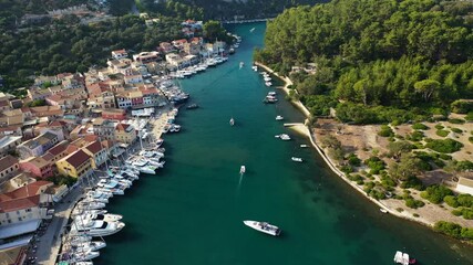 Wall Mural - Aerial drone video of iconic port of Gaios a natural fjord bay ideal for safe anchorage in island of Paxos, Ionian, Greece