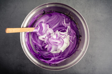 Mixing Meringue into Ube Cake Batter: Using a spatula to mix up cake batter made with purple sweet potatoes