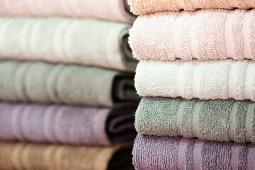 Leinwandbilder - Colorful folded towels stack closeup picture.