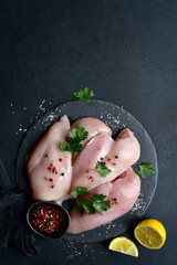Wall Mural - Raw organic chicken breasts with ingredients for making. Top view with copy space.