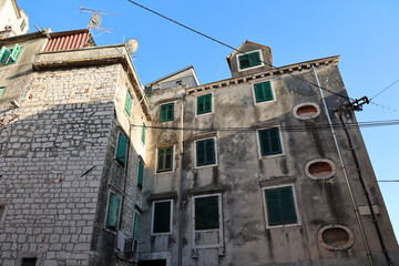 Wall Mural - Stone houses in the cities of Croatia; a low angle view