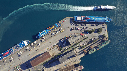 Wall Mural - Aerial drone photo of famous and busy port of Piraeus where passenger ferries travel to Aegean destination islands as seen from high altitude , Attica, Greece