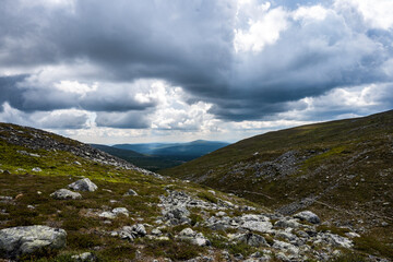 Sticker - Beautiful view of green mountains under a cloudy sky