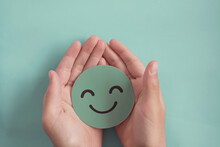 Hands Holding Green Happy Smile Face, Good Feedback Rating,positive Customer Review, Experience, Satisfaction Survey ,assessment, Child Wellness,world Mental Health Day, Compliment Day Concept