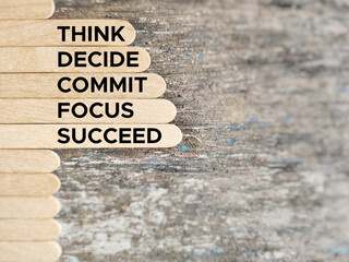 Wall Mural - Inspirational and Motivational Concept - THINK DECIDE COMMIT FOCUS SUCCEED text background. Stock photo.