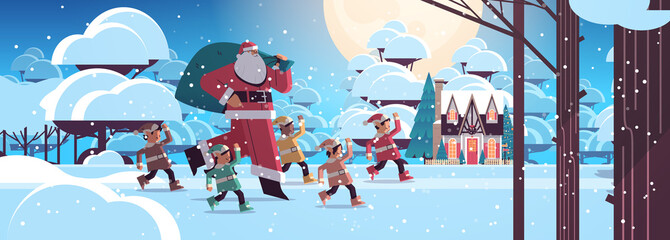 Wall Mural - santa claus with mix race elves in night snowy forest happy new year merry christmas holidays celebration concept