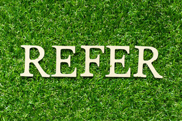 Poster - Wood letter in word refer on green grass background