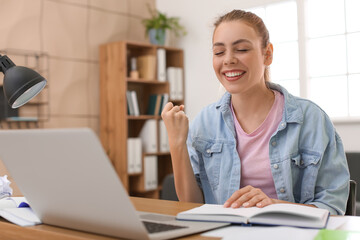 Wall Mural - Female student preparing for exam at home