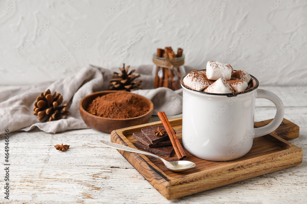 Mug of delicious hot chocolate on table