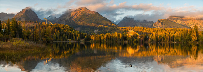 Wall Mural - Autumn Panorama Strbske Pleso Lake. Calm, autumn evening scene of High Tatras National Park, Slovakia, Europe.