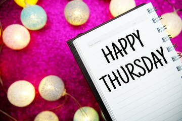 Wall Mural - happy thursday text notepad mockup and led cotton balls decoration on pink bokeh background