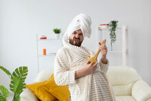 Funny Handsome Man Pretends To Play On Massage Brush As A Guitar. Fun, Spa And Humor Concept.