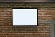 © pomphotothailand - Beautiful black wooden photo frames with light and shadow on the brick wall background decoration.
