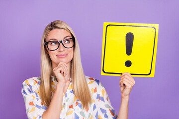 Photo of dreamy funny mature lady dressed print blouse glasses looking holding alert card smiling isolated purple color background