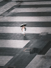 High Angle View Of A Woman Walking On The Street.