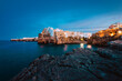 Polignano a Mare at sunset (blue hour) seen from the panoramic point in front of the village
