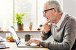 © Rawpixel.com - Senior Adult Using Laptop Thinking Concept