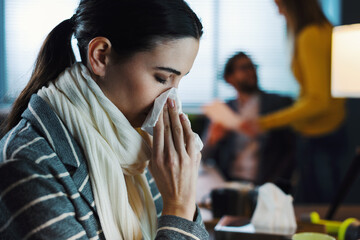 Wall Mural - Woman working in the office and having a cold