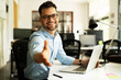 © JustLife - Young businessman working with laptop at office. Businessman giving a hand for handshake