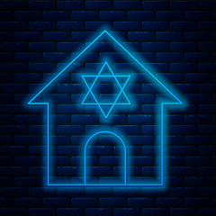 Sticker - Glowing neon line Jewish synagogue building or jewish temple icon isolated on brick wall background. Hebrew or judaism construction with David star. Vector