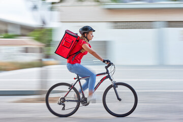 Bike messenger courier delivering in city with motion blur