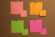 © New Africa - Colorful paper notes pinned to cork board