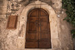 Castelvecchio Calvisio medieval town, wooden door.