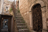 Fototapeta Na drzwi - Castelvecchio Calvisio medieval town, narrow streets, steps, archs and medieval buidings