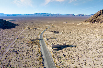 Wall Mural - Aerial view of the abandoned ruins of Rhyolite mining camp in the Nevada desert. This Ghost town sits just outside the entrance to Death Valley National Park.